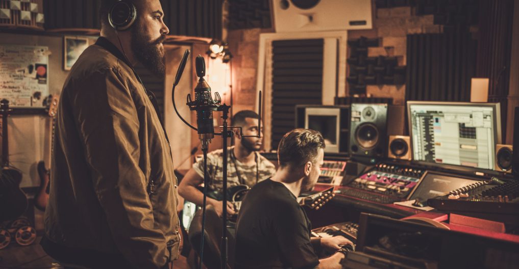 Professional music band recording song in boutique recording stu Professional music band recording song in boutique recording studio.